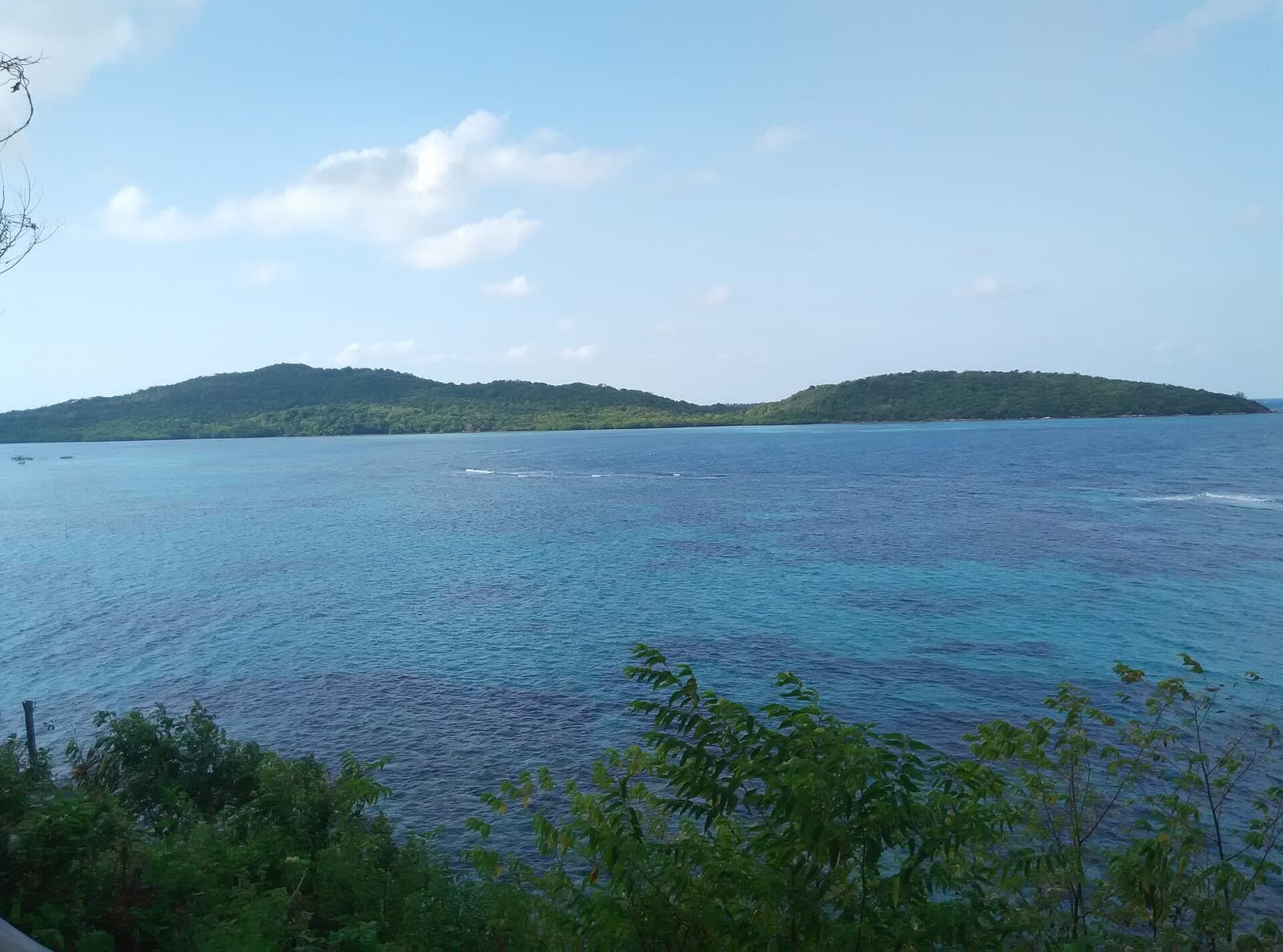 View from a hilltop on Karimunjawa over forest, coast and offshore islands