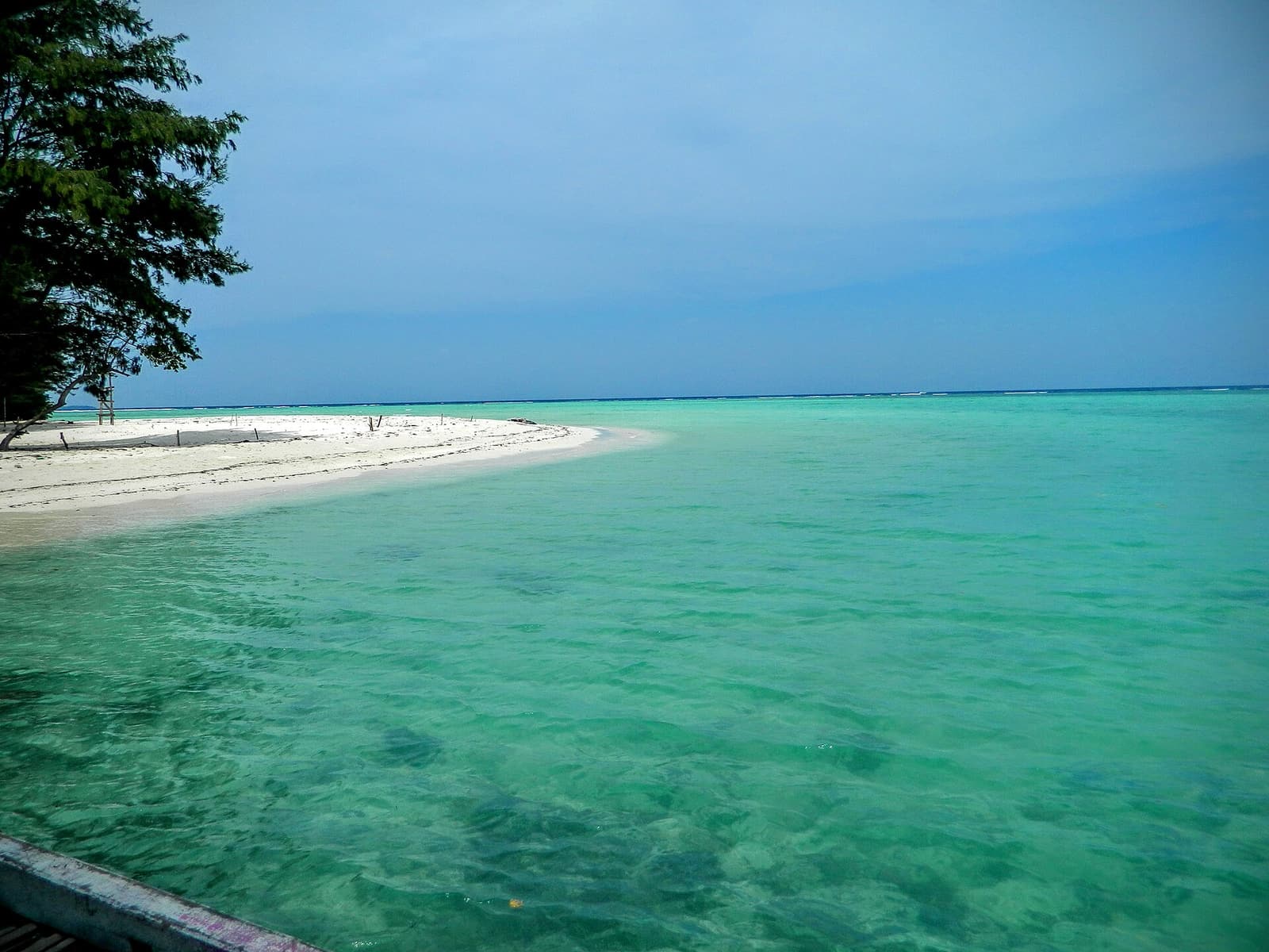 A sandbar and turquoise shallows at Geleang island, Karimunjawa